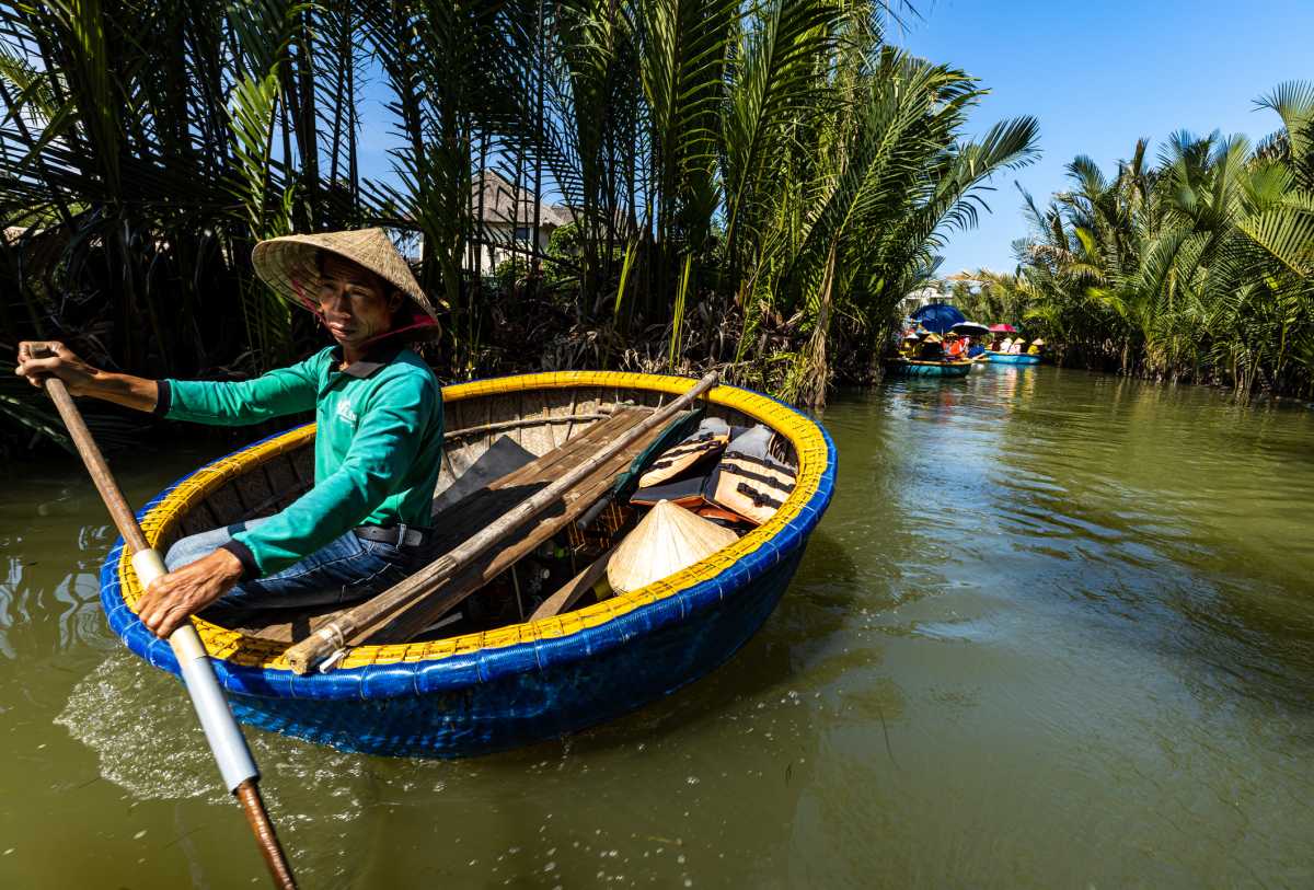 Traditional coconut boat on a calm river.