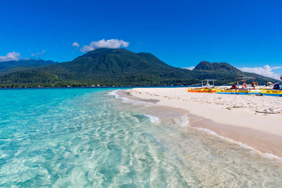 Sandy beach with crystal clear water.