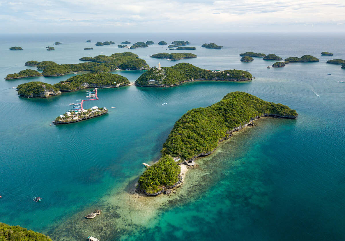 Aerial view of green islands and blue sea.