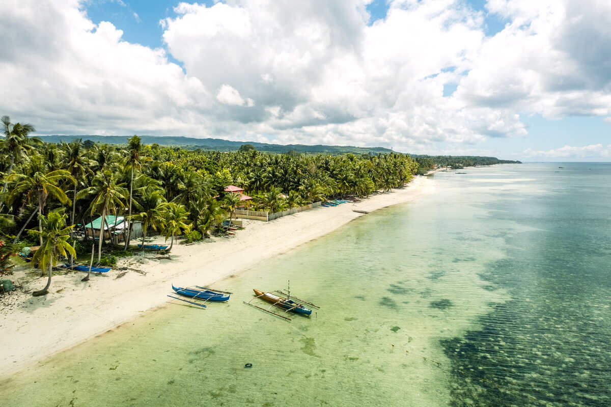 Tropical beach with clear water and white sand.