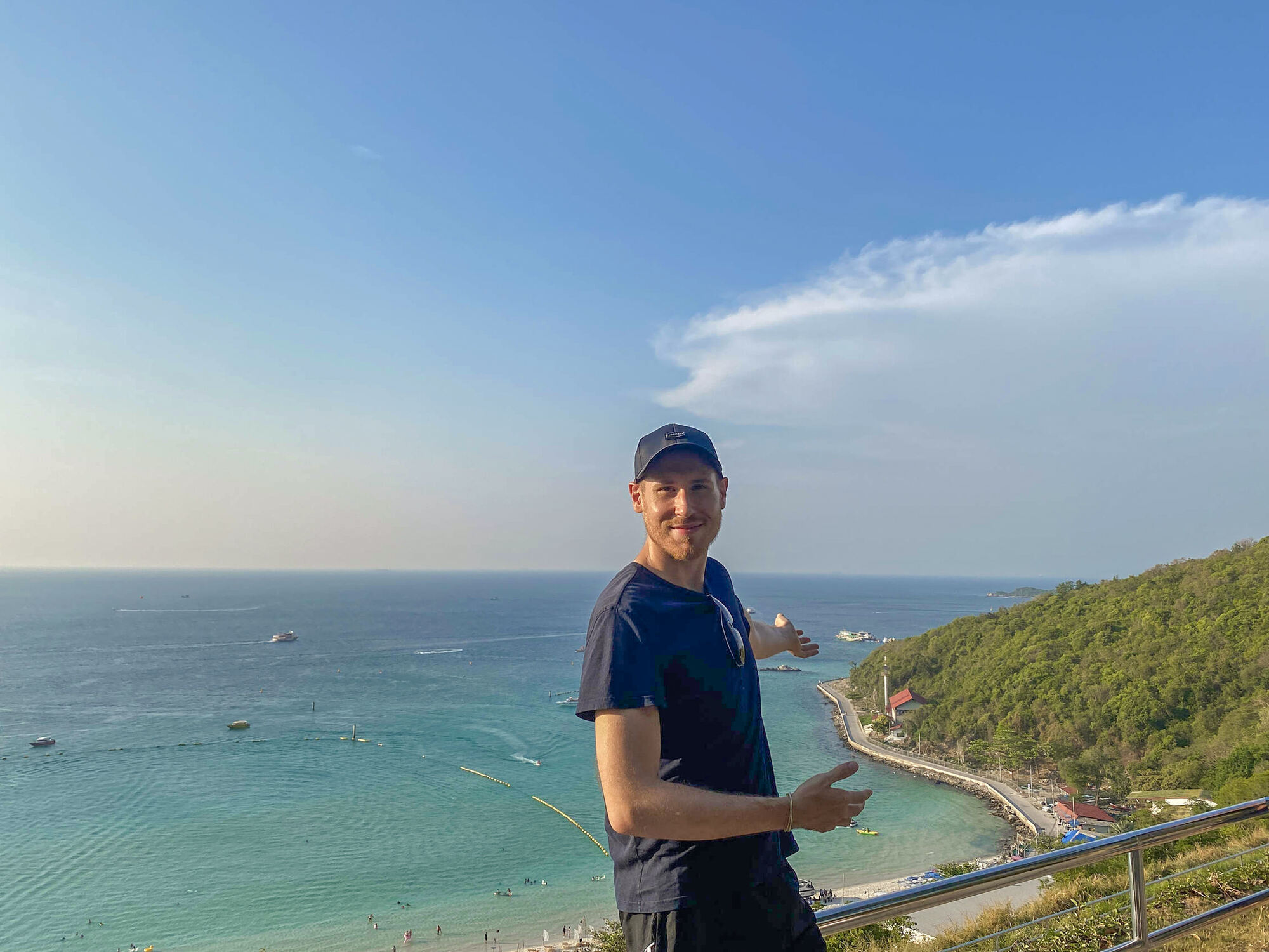 Man enjoying and showing views of a beach in Thailand