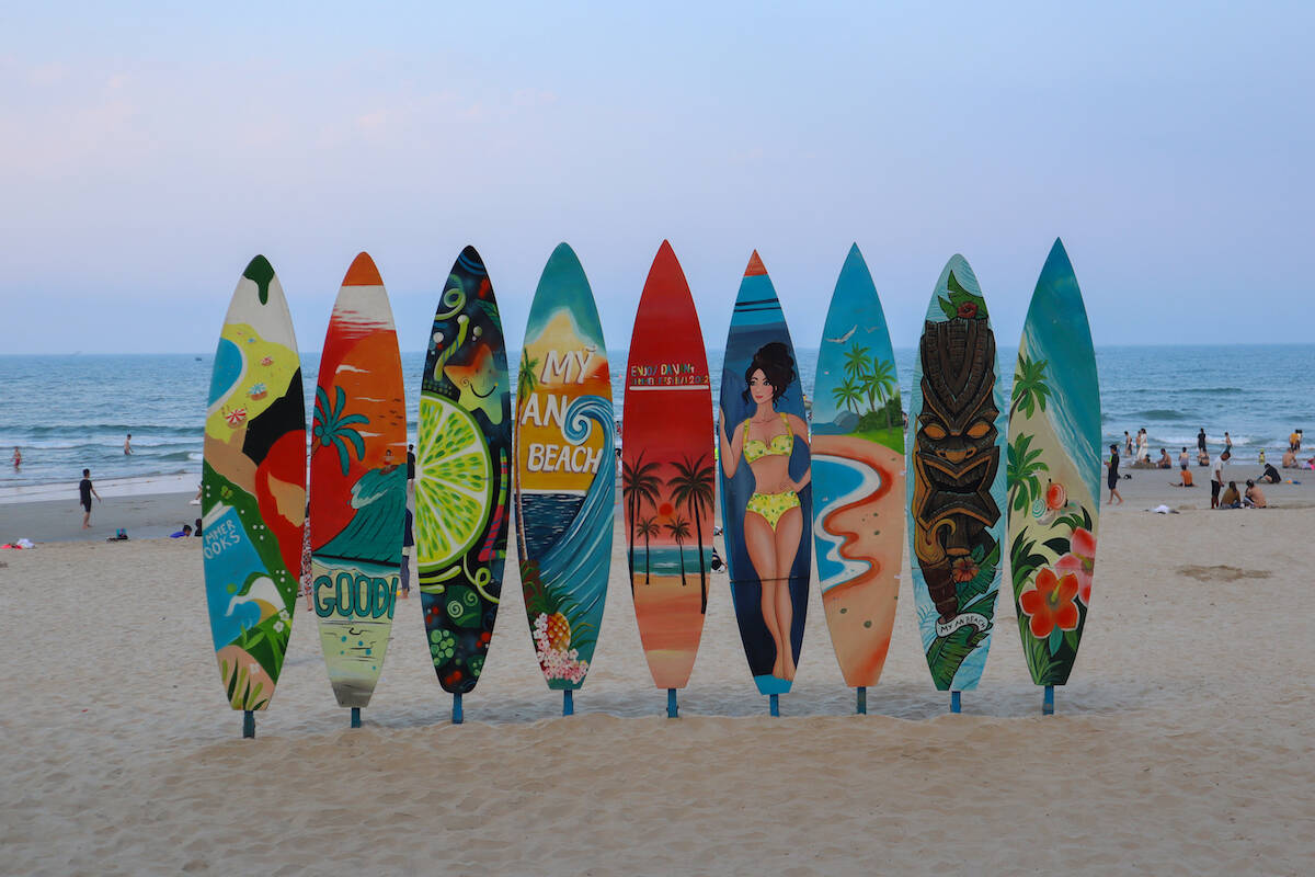 Surfboards painted with vibrant designs.