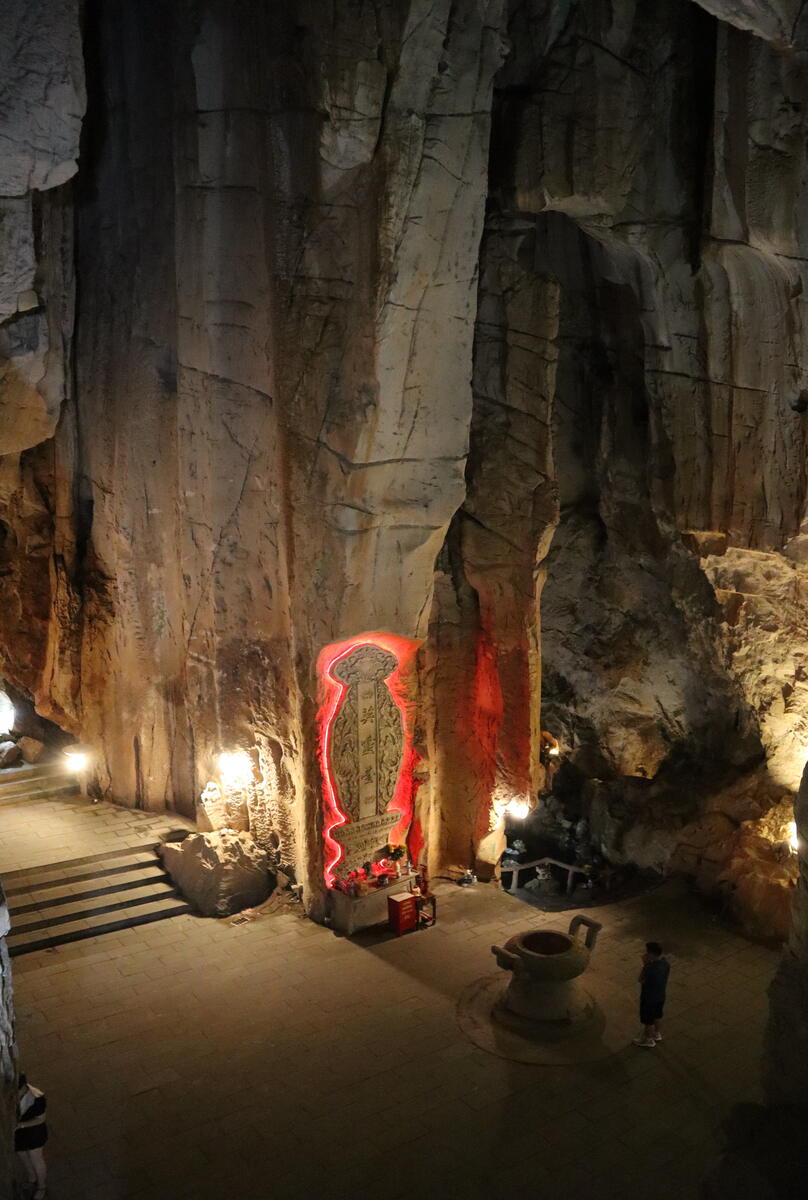 Carved rock wall with Buddhist figures.