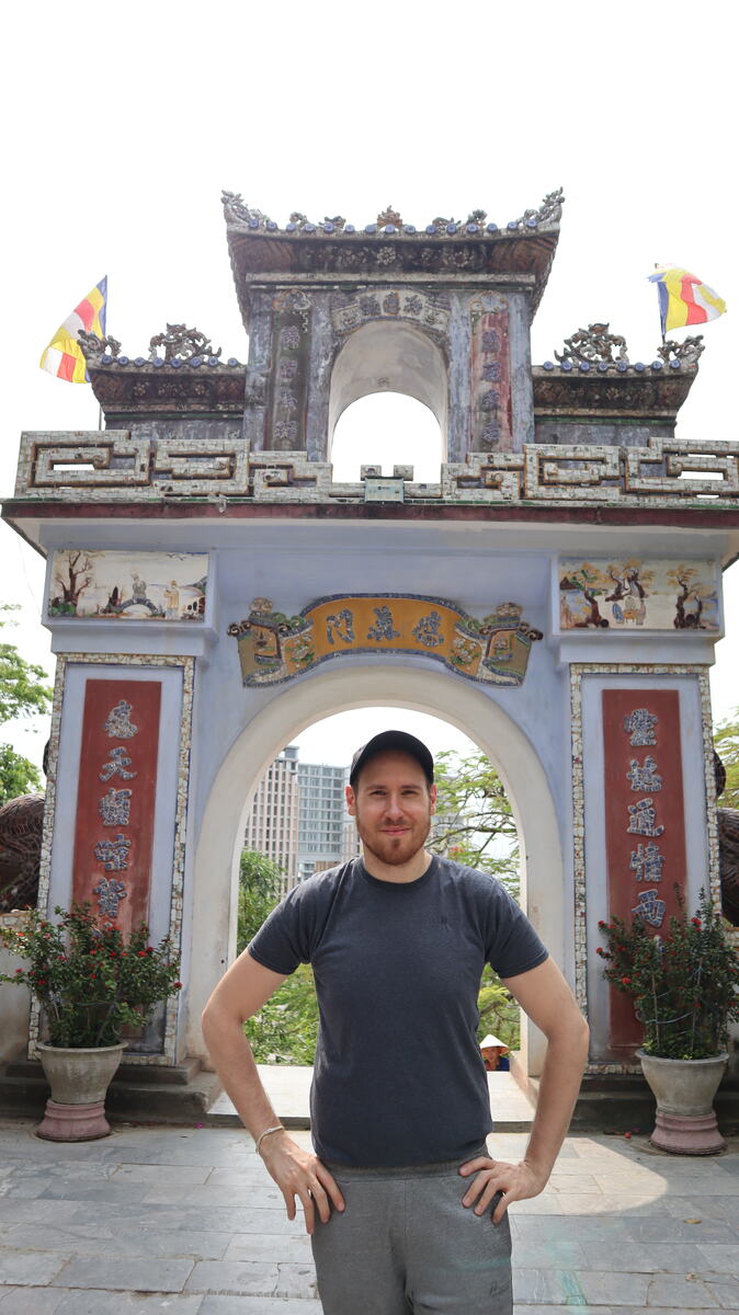 Man posing for a photo at the marble mountain