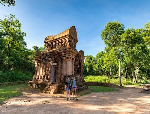 Ancient stone temple with visitors.