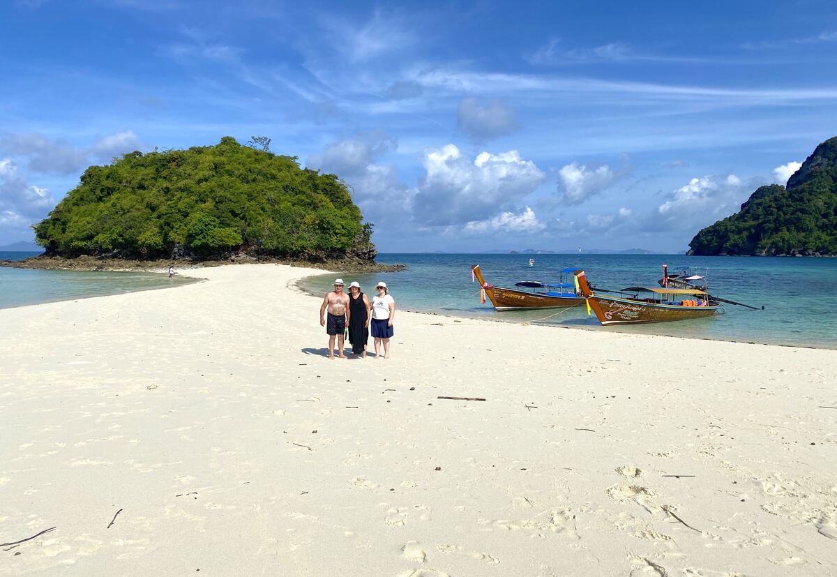 Pristine white sand beach with clear water.