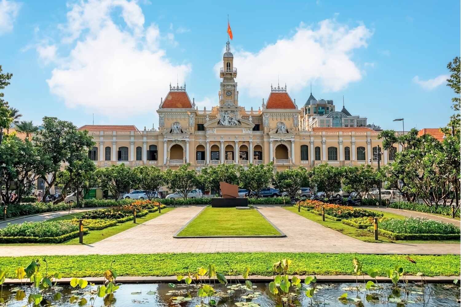 Colonial French palace with gardens and a clear blue sky.