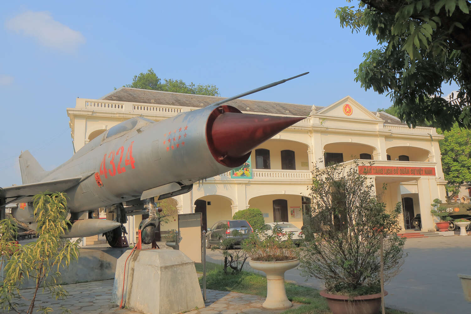 Old cannon exhibition at a historic military fortification under a clear sky