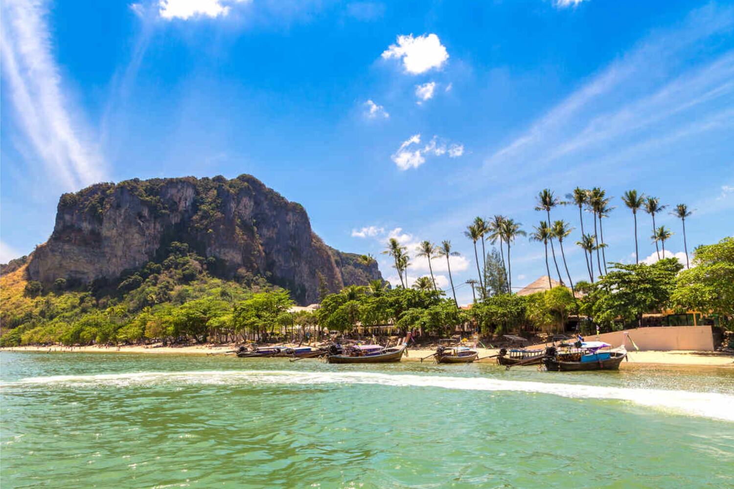 Beachfront with palm trees and a mountain backdrop. Things to do in Ao Nang Krabi