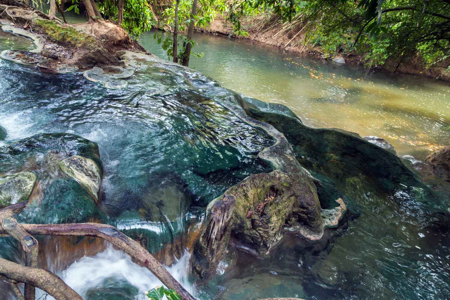 Natural pool with rocks and waterfall. Relax-in-the-Krabi-Hot-Springs